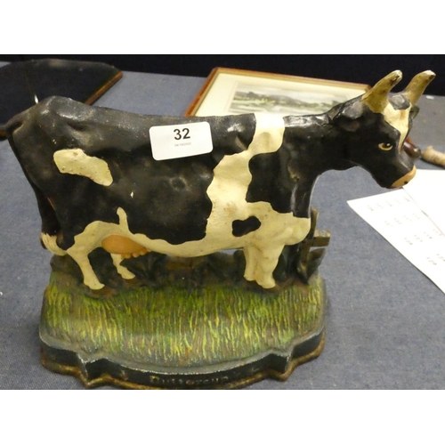 32 - Two cast iron modern door stops, one in the form of a cow and the other a pig.