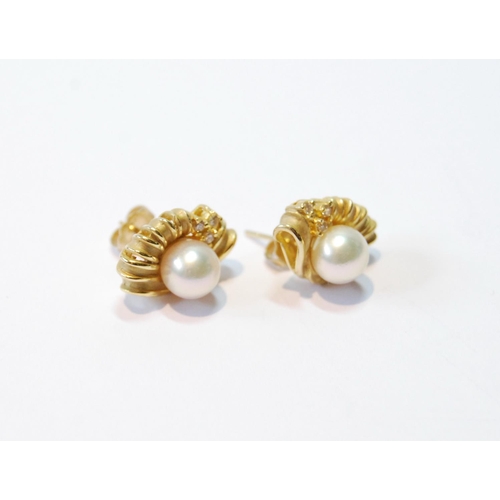 102 - Pair of gold earrings, each with a pearl and small diamonds, '585', 5.6g.