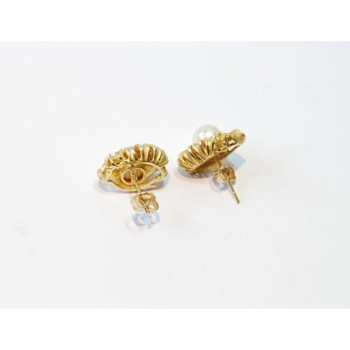 102 - Pair of gold earrings, each with a pearl and small diamonds, '585', 5.6g.