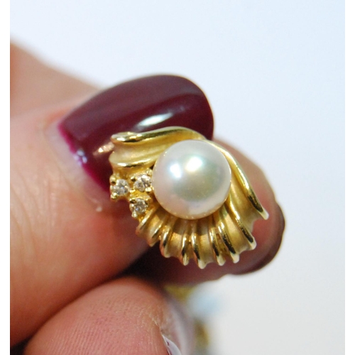 102 - Pair of gold earrings, each with a pearl and small diamonds, '585', 5.6g.