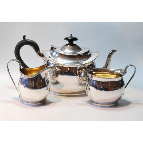 121 - Silver three-piece tea set of plain boat shape with reeded edges, by Nathan & Hayes, Birmingham ... 