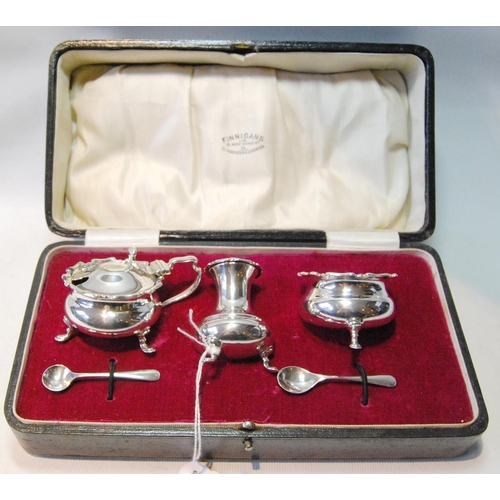 124 - Silver three-piece condiment set of baluster shape, by Harry Atkin, Sheffield 1919, cased, 157g or 5... 