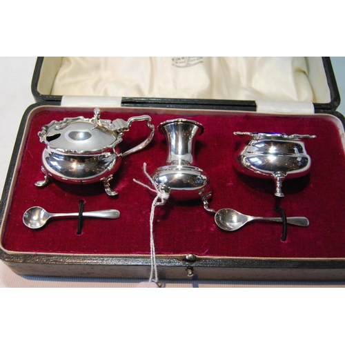 124 - Silver three-piece condiment set of baluster shape, by Harry Atkin, Sheffield 1919, cased, 157g or 5... 