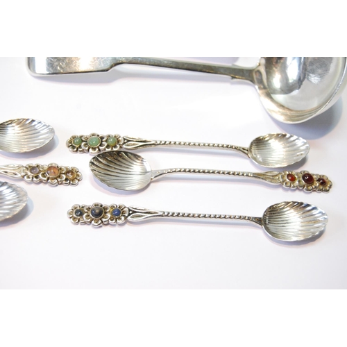 129 - Two silver sauce ladles, 1828 and 1844, and six coffee spoons with inset gem cabochons, '833', 110g ... 