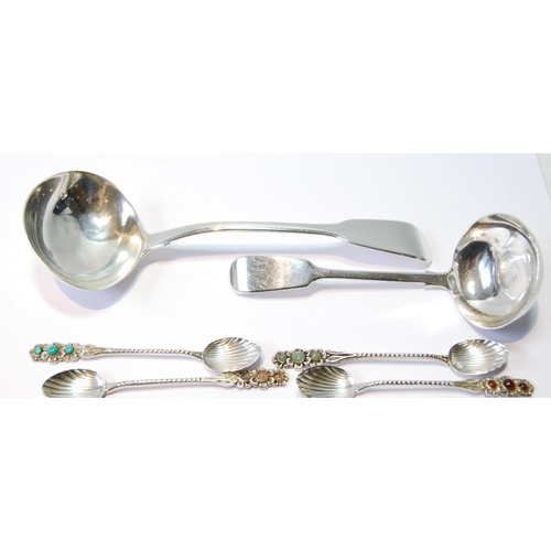 129 - Two silver sauce ladles, 1828 and 1844, and six coffee spoons with inset gem cabochons, '833', 110g ... 