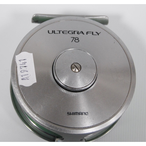 Pflueger Trion fly reel, no. 2858, 10.5cm diameter and a Shimano Ultegra Fly  78 reel, 10cm diameter.