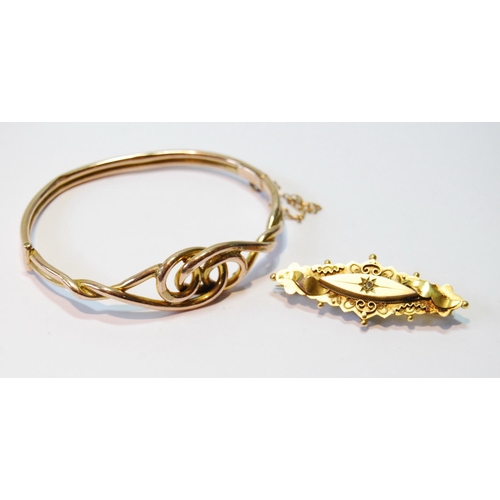 70 - Gold hinged bangle, probably 9ct, and a bar brooch, 10.3g.