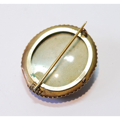 72 - Victorian gold oval brooch with pearl-set enamel star, 38mm, 10g gross.