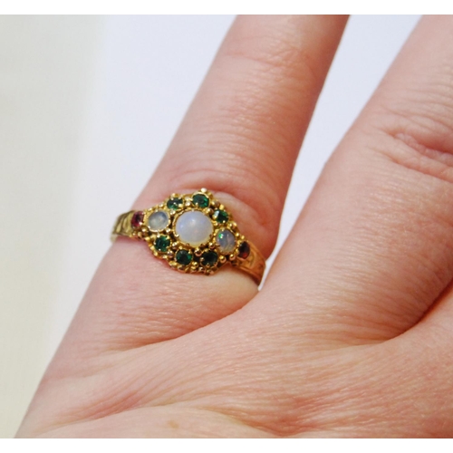 73 - Victorian 15ct engraved gold ring with opals, emeralds and garnets, 1871, size M.