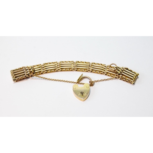 74 - Edwardian gold gate bracelet, 10mm wide, with padlock, '9ct', and spare link, 13.9g.