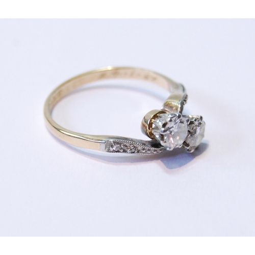 76 - Diamond two-stone cross-over ring with brilliants,  approximately .25ct, 1962, size L.