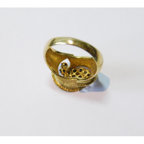 77 - 18ct gold ring with double spiral enclosing eleven sapphire collets, 1974, size M, 5g.