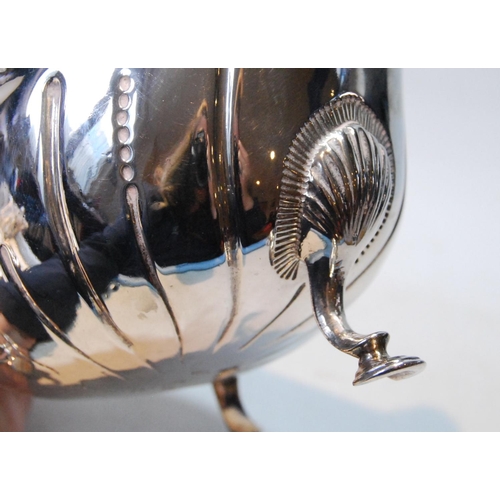 82 - Irish silver sauce boat of large size, crested, with waved flutes and punch bead border, on pad feet... 