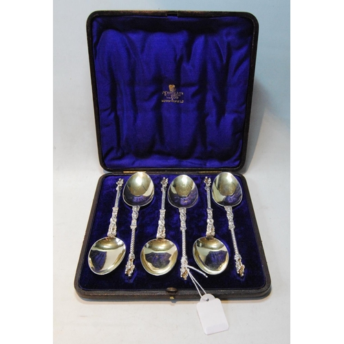 88 - Set of six silver dessert spoons, parcel gilt, with spiral handles and figure terminals, by Martin &... 