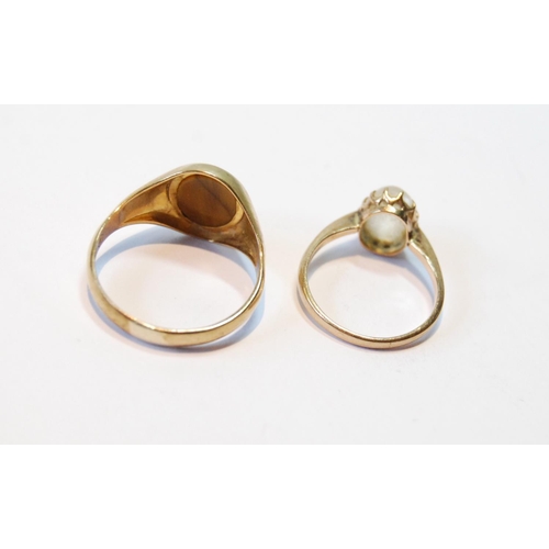 91 - 9ct gold ring with tiger's eye and another with chalcedony, sizes P and I.  (2)