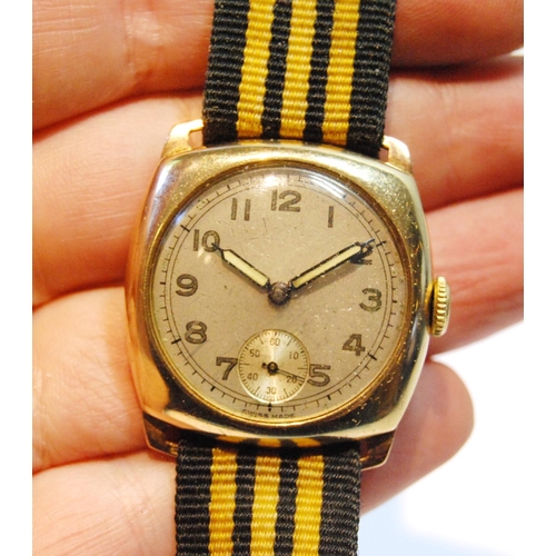 99 - 9ct gold watch with silvered dial in 9ct gold cushion case, 1944, 29mm, excluding button, Longines b... 