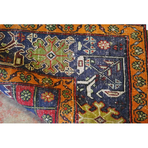 317 - Old Turkish Konya rug decorated with a central floral medallion and geometric and floral motifs to t... 