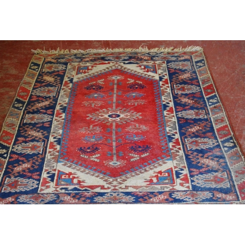 319 - Turkish Dosemealti hand-knotted rug decorated all over with geometric motifs, on a red, white and bl... 