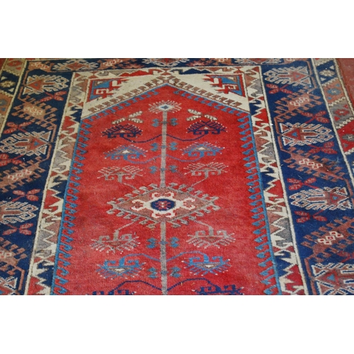 319 - Turkish Dosemealti hand-knotted rug decorated all over with geometric motifs, on a red, white and bl... 