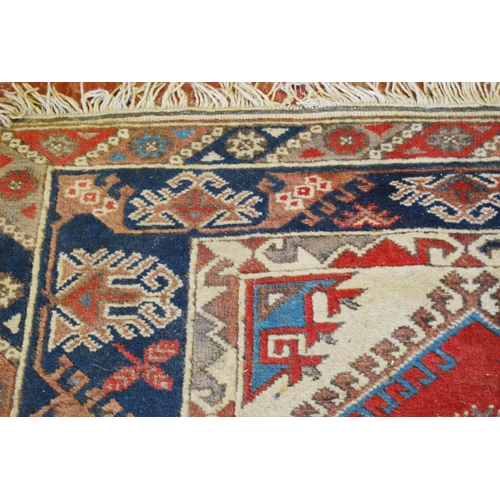 319 - Turkish Dosemealti hand-knotted rug decorated all over with geometric motifs, on a red, white and bl... 