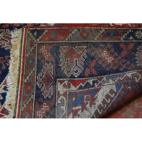 319 - Turkish Dosemealti hand-knotted rug decorated all over with geometric motifs, on a red, white and bl... 