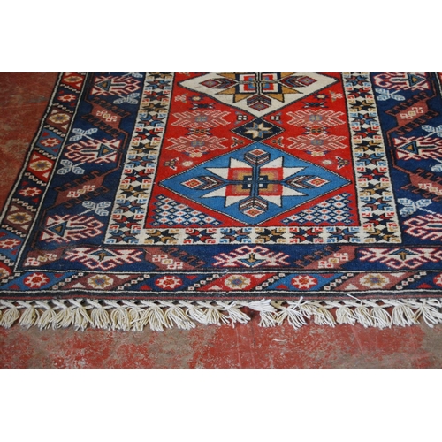 320 - Turkish Dosemealti hand-knotted rug decorated with three geometric medallions to the centre with fur... 