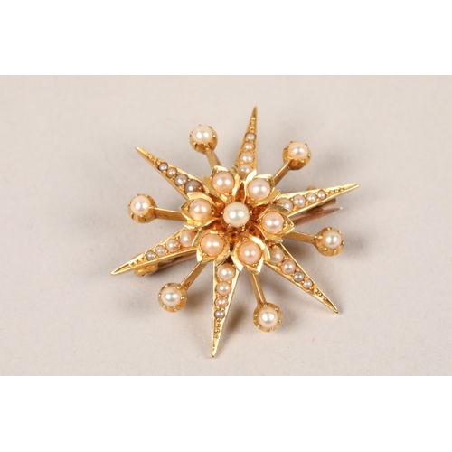 116 - Yellow metal seed pearl starburst brooch; gross weight 5.9g