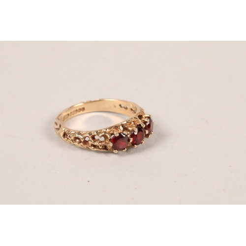 159 - 9 carat yellow gold three red stone ring; ring size M 1/2; gross weight 2.8g