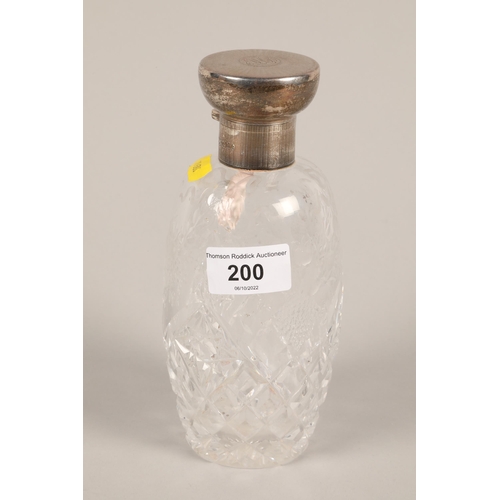 200 - George V hallmarked silver lidded and cut glass scent bottle; Mappin & Webb; London 1919