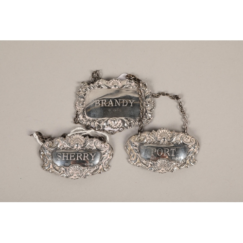 202 - Three silver spirit labels;  gross weight 29g