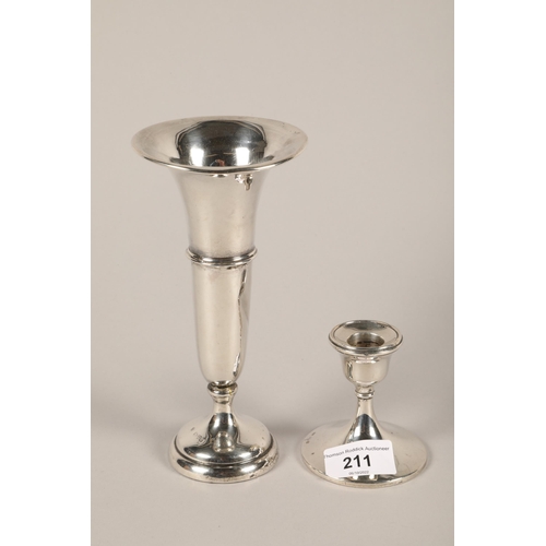 211 - Hallmarked silver dwarf candlestick and a hallmarked silver trumpet vase; gross weight 250g