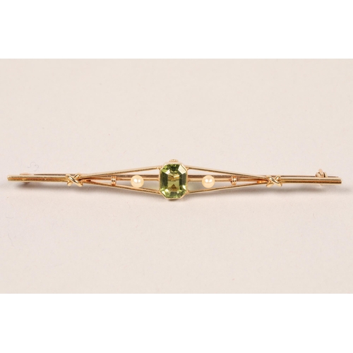 96 - 9ct gold peridot and seed pearl bar brooch; 8cm long; gross weight  5.1g