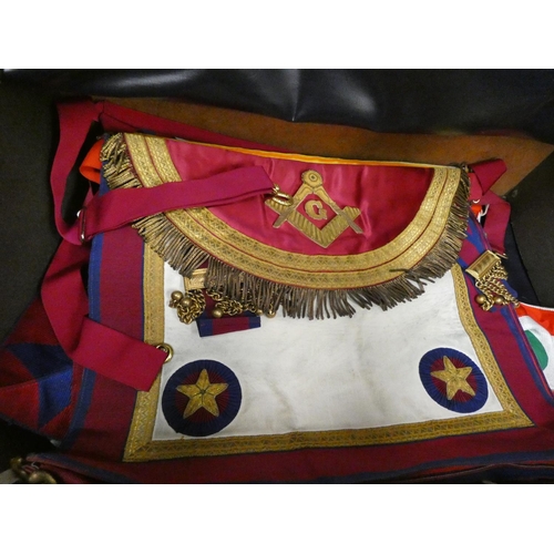 202 - Large case of Masonic regalia including aprons, booklets, jewels, etc.