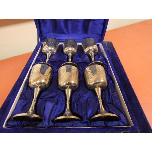 289 - Twelve epns wine goblets, in blue velvet cases.