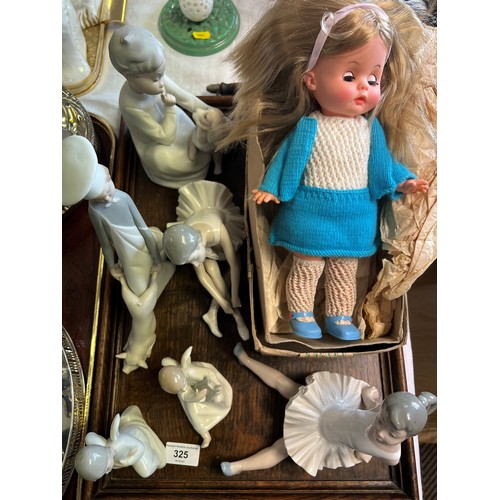 325 - Six Nao and Lladro figures; together with a doll in box