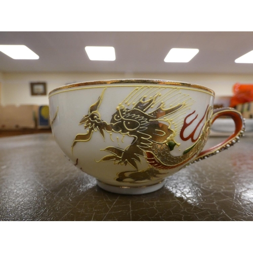 301 - Japanese Dragon tea set, one saucer (a/f).