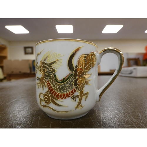 301 - Japanese Dragon tea set, one saucer (a/f).