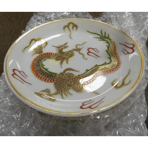 301 - Japanese Dragon tea set, one saucer (a/f).