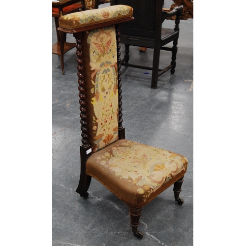 389 - Victorian rosewood prie-dieu with barley column frame, upholstered in floral fabric with eagle decor... 