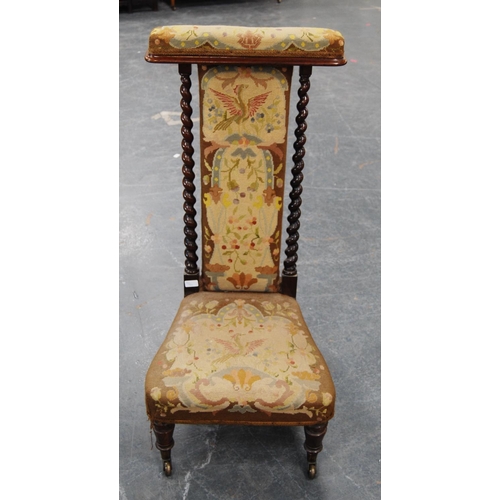 389 - Victorian rosewood prie-dieu with barley column frame, upholstered in floral fabric with eagle decor... 