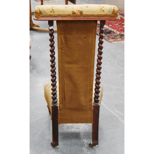 389 - Victorian rosewood prie-dieu with barley column frame, upholstered in floral fabric with eagle decor... 