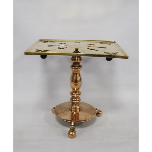 204 - Georgian brass trivet with a square pierced top, on turned column, circular base and tripod ball fee... 