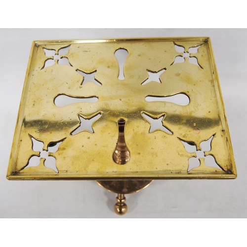 204 - Georgian brass trivet with a square pierced top, on turned column, circular base and tripod ball fee... 