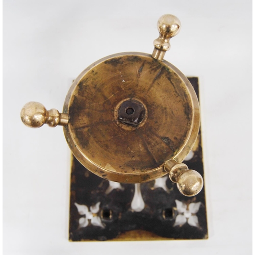 204 - Georgian brass trivet with a square pierced top, on turned column, circular base and tripod ball fee... 