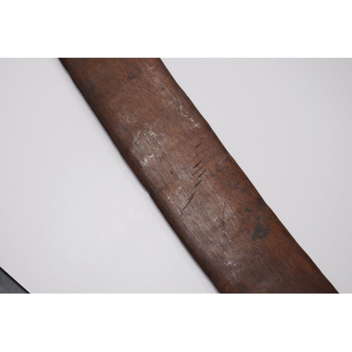 214 - Aboriginal fish tail paddle club (Rainforest sword), with shaped grip, 147.5cm long and 13.5cm wide.