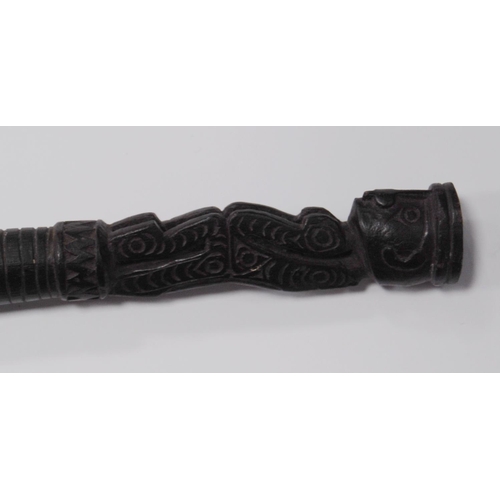 215 - Papua New Guinea Malangan ebonised staff with tribal figure grip, incised markings and scrolls to th... 