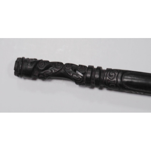 215 - Papua New Guinea Malangan ebonised staff with tribal figure grip, incised markings and scrolls to th... 