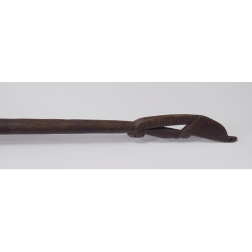 216 - Indonesian carved wood paddle/spear, possibly from the Dayak Tribe, with incised markings to the har... 