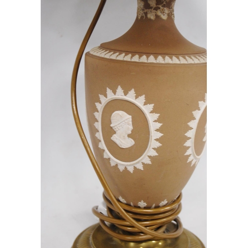 235 - Wedgwood brown Jasper ware table lamp decorated with classical masks, on brass circular foot, approx... 