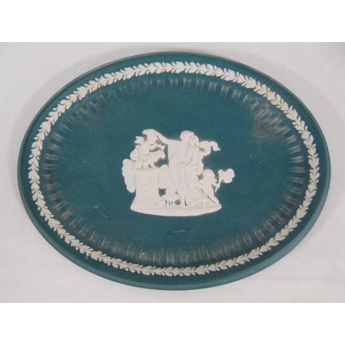 236 - Four pieces of Wedgwood sea green Jasper ware to include a bowl, oval dish and a pair of spill vases... 